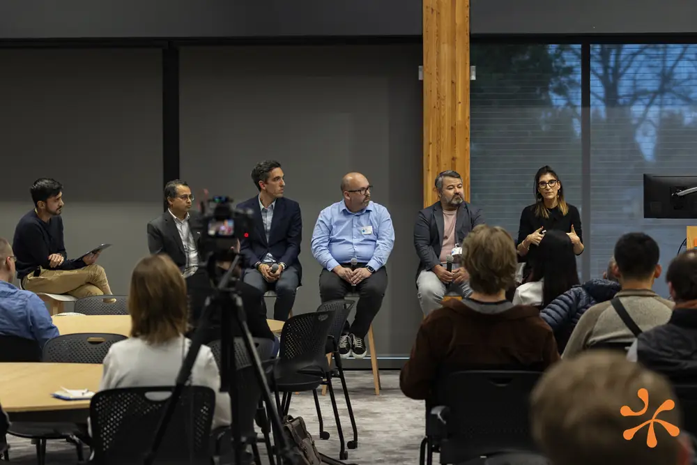 Panel discussion in front of a seated audience