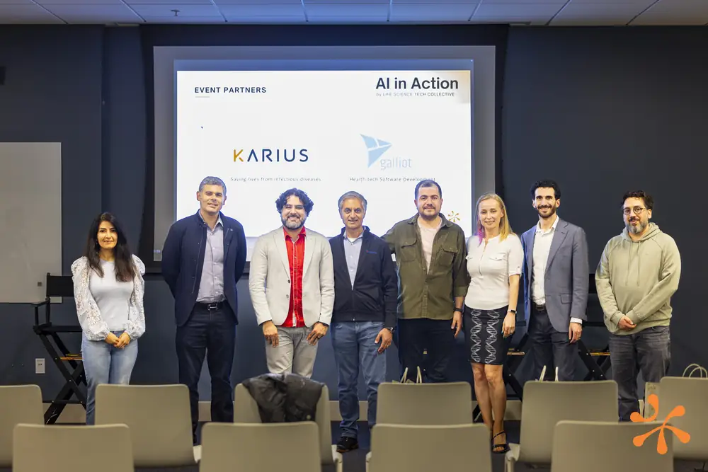 Speakers and organizers posing together at an AI in Action event